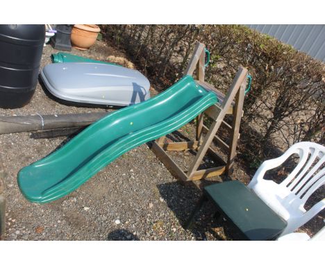 A child's plastic slide mounted to wooden step frame