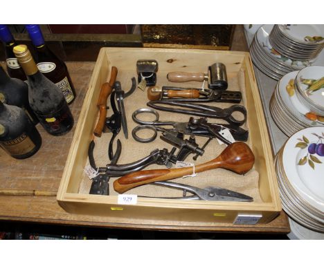 A wooden tray containing vintage hand tools including veneer hammer, panel beaters dolly etc.