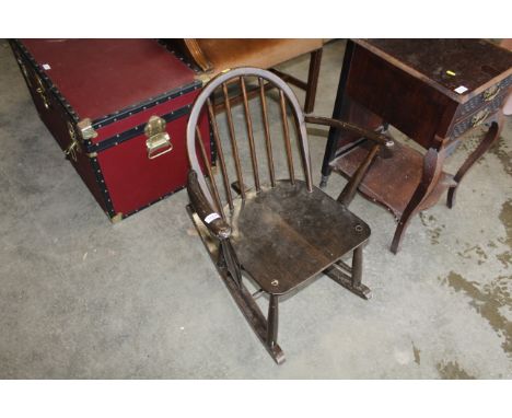A stick back rocking chair