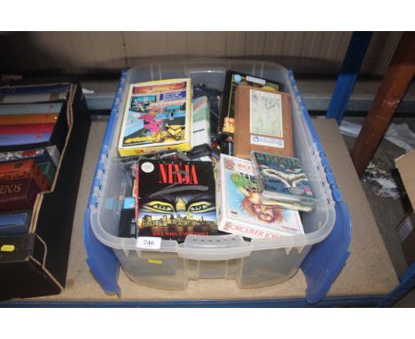 A box of Commodore 64 and other vintage video games, together with a Quickshot joystick