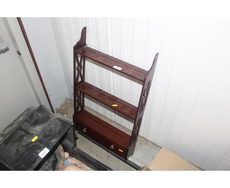 A mahogany wall shelf fitted with single drawer