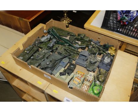 A collection of vintage die-cast military vehicles including Dinky