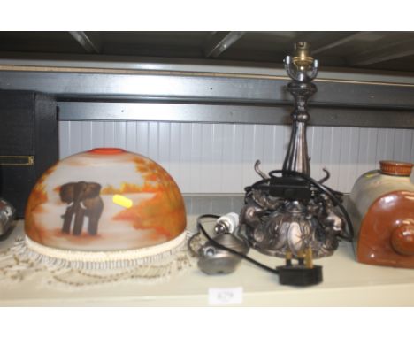 A table lamp and shade decorated with elephants