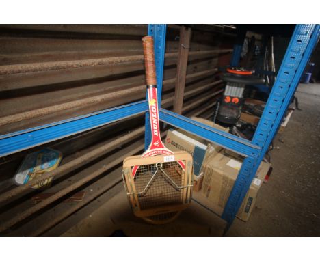 A vintage Dunlop Red Diamond tennis racket with clamp