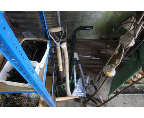 A quantity of gardening tools to include digging fork, axe, rakes, loppers etc.