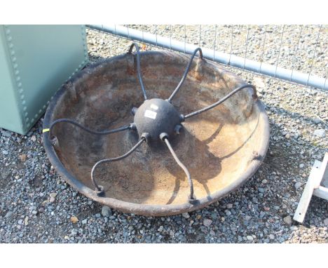 A circular part partitioned pig trough