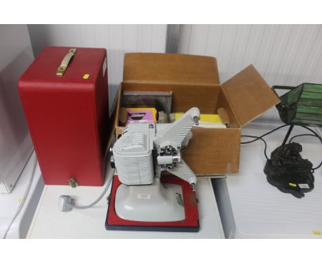 A projector sold as a collectors item, with accessories