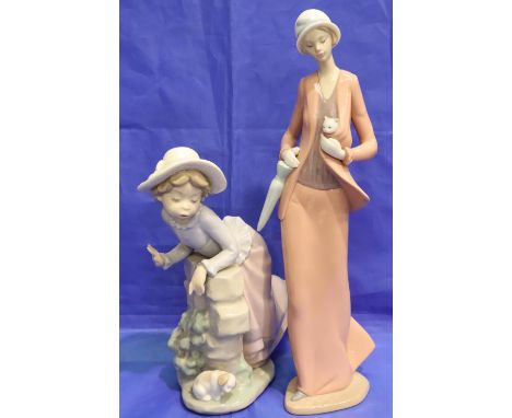 Two Nao figurines, tip of the umbrella missing. P&amp;P Group 3 (£25+VAT for the first lot and £5+VAT for subsequent lots) 