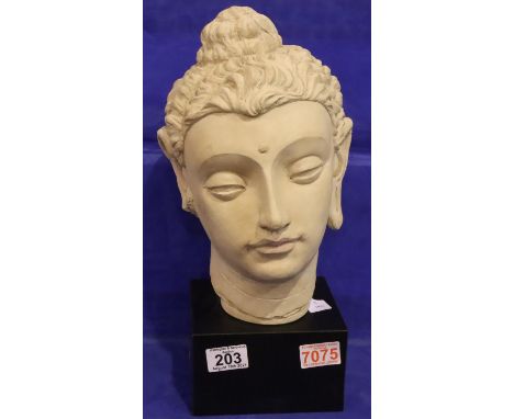 Life size ceramic head on a wooden base. H: 38 cm. P&amp;P Group 3 (£25+VAT for the first lot and £5+VAT for subsequent lots)
