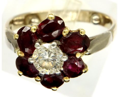 18ct gold diamond and ruby flower ring, size I, 3.7g. P&amp;P Group 1 (£14+VAT for the first lot and £1+VAT for subsequent lo