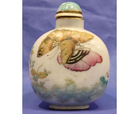 An 18th-19th century Chinese snuff bottle of rounded form, decorated with butterflies and flora, H: 78mm light pitting and su