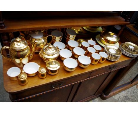 A collection of Royal Worcester gilt tea and dinnerwares. 