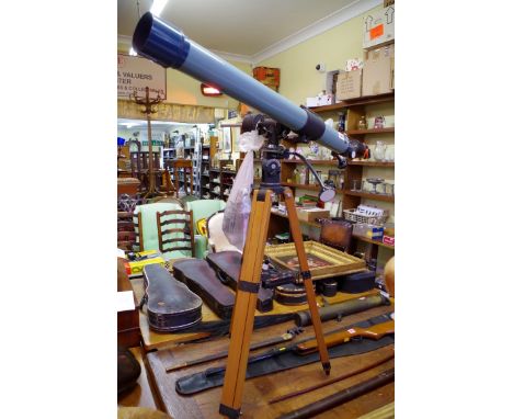 A Prinze Astral 500 telescope on tripod legs.