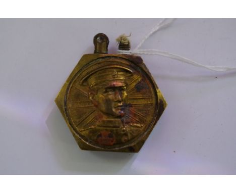 A brass Trench Art hexagonal lighter, 4.5cm wide.