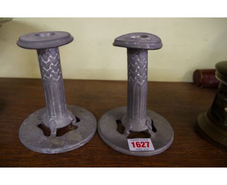 A rare pair of Liberty 'Tudric' pewter candlesticks,  No. 022, 13.5cm high.