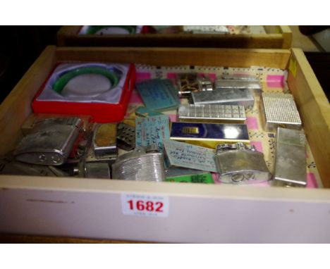 A collection of lighters; together with a jade bangle. 