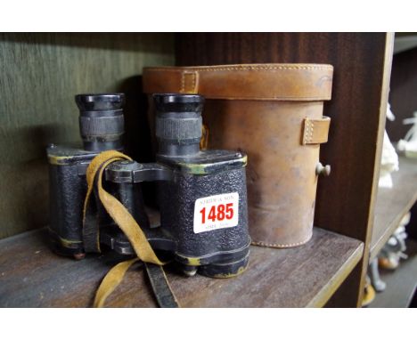 A pair of World War II Kershaw binoculars, in tan leather case, with broad arrow mark. 