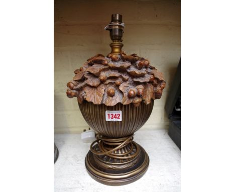 A simulated carved wood table lamp. 