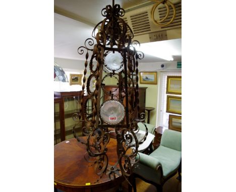 A vintage French wrought iron hanging lantern, having circular glass insets, 93cm high. 