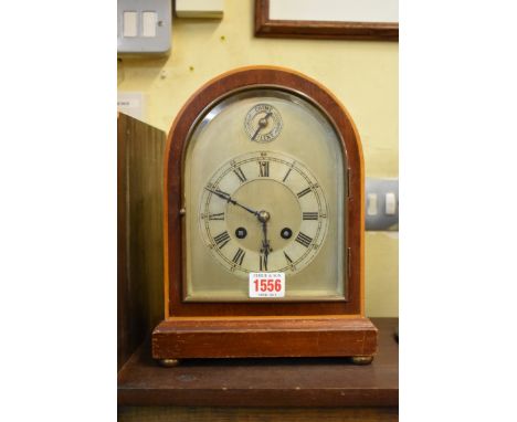 An Edwardian mahogany dome top musical mantel clock, striking on 5 gongs, 26.5cm high. 