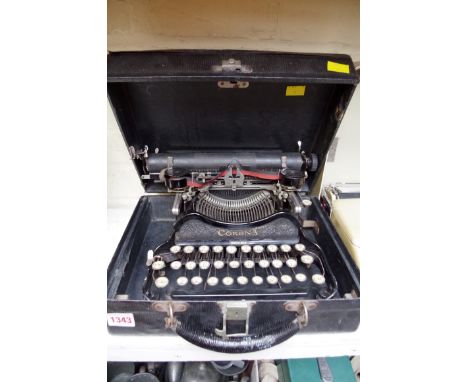 A vintage Corona typewriter, boxed; together with another Olympia typewriter. 