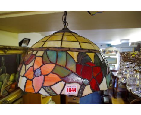 A Tiffany style stained and leaded glass ceiling light, 39cm diameter. 