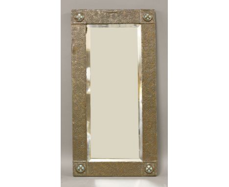 A copper wall mirror,the rectangular bevelled plate, in a spot hammered copper frame, with turquoise roundels to each corner,