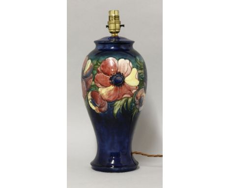 A Moorcroft 'Anemone' pattern lamp,with a facsimilie impressed signature, original paper label,32cm high 53cm overall