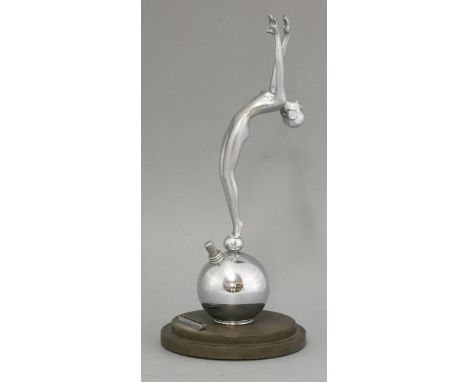 An Art Deco chrome table lighter,the nude standing on a globe, fitted with a touch-tip lighter,28cm high