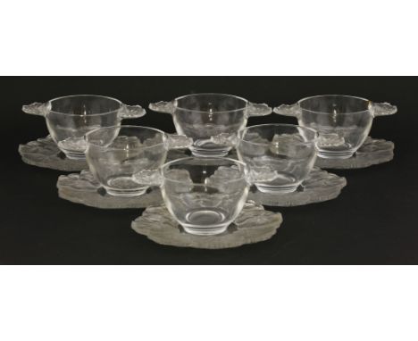 A set of six Lalique clear and opaque glass fruit bowls and saucers, with moulded geranium border, etched Lalique frame (6)
