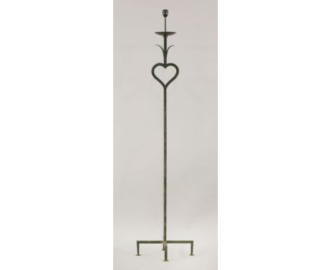 A wrought iron standard lamp,after a design by Gilbert Poillerat (1902-1988),181cm high overallProvenance:	Bought in the Sout