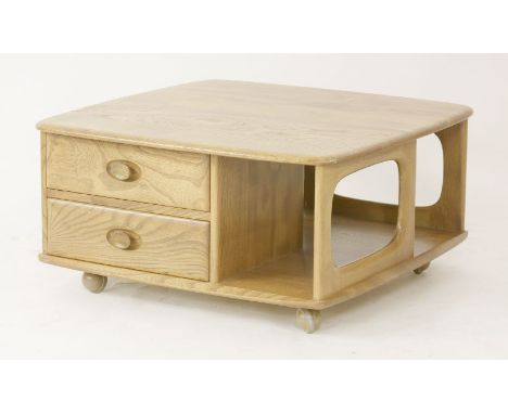 An Ercol 'Pandora's Box' coffee table,with drawers and bookshelves, on castors,81cm square38cm high