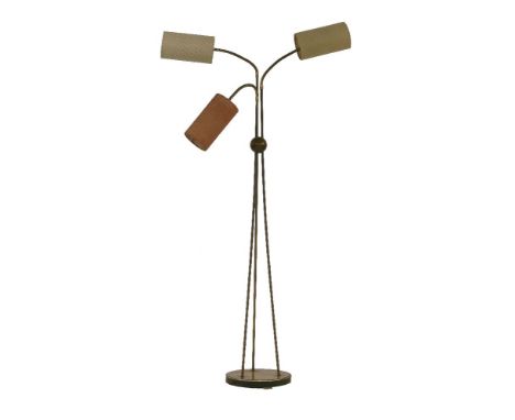A brass and walnut tripod standard lamp,with three 'gooseneck' branches and lights, with cylindrical shades,153cm high