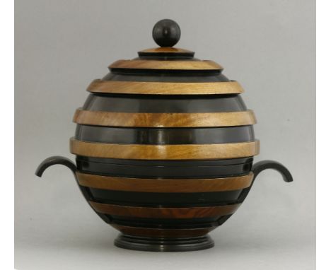 An Art Deco walnut-banded and ebonised table centre,of globe form divided into five compartments, with loop handles and a tur