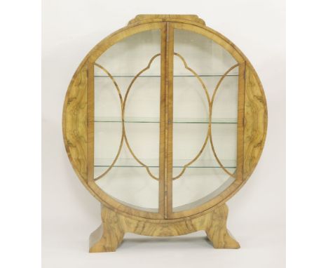 An Art Deco walnut globe display cabinet,with shaped fret cut glazing bars, with three glass shelves, raised on a splayed pli