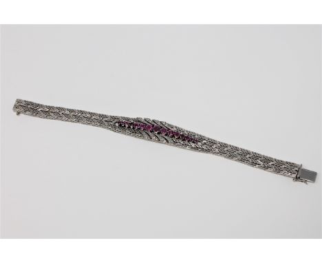 A fine quality ruby and diamond bracelet in 18ct white gold, 52g.