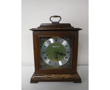 A Seth Thomas brass faced mantel clock