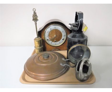 A tray containing oak mantel clock, copper bed warmer, railway lamp, silver plated swan ornament together with a fire brush