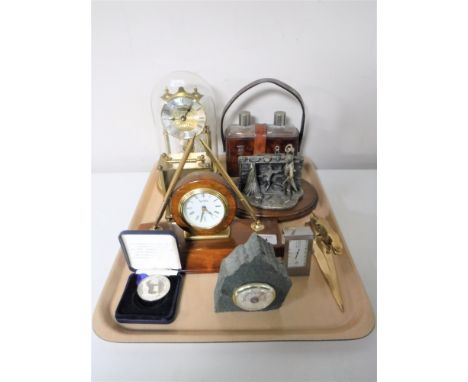 A tray containing a Jaguar letter opener, anniversary clock, carriage clock, desk clocks, Evergreen Collection pewter figure 