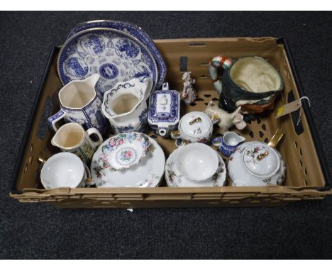 A box containing a large Royal Doulton character jug, Ringtons blue and white china, floral tea service, Sylvac dog, Paragon 