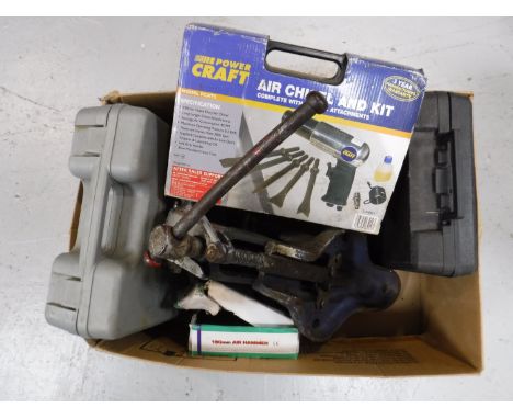 A heavy duty bench vice, together with a box containing air compressor tool kits, a cased Fern cordless drill, etc 