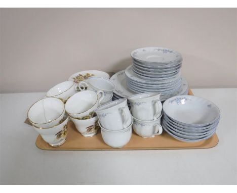 A tray containing a West German tea and dinner service, together with six Crown Trent bone china trios  