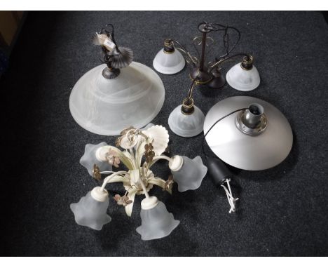 Three contemporary metal light fittings with glass shades together with a circular chrome hanging light fitting