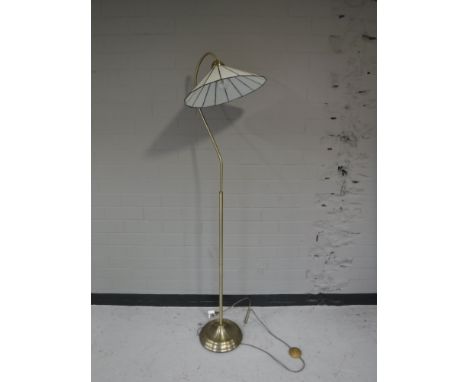 A black glass three tier LCD TV stand, together with a brass standard lamp with leaded glass shade