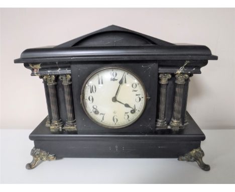 An Edwardian mantel clock with enamelled dial and key