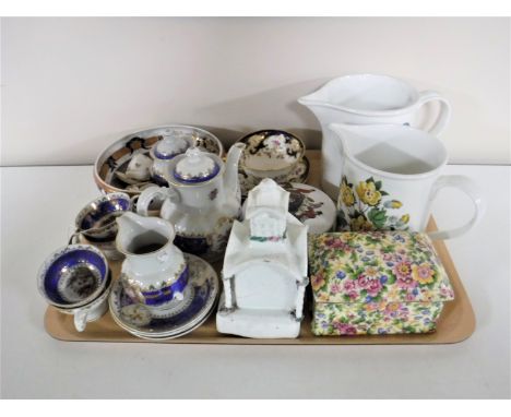 A tray containing children's tea service, miniature German tea service, two Portmeirion jugs, a Royal Winton chintz lidded mu