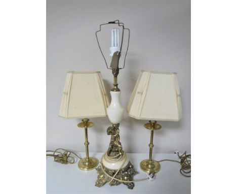 A brass cherub table lamp, together with a pair of brass table lamps with shades