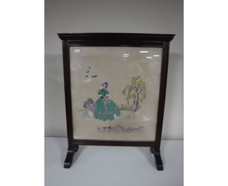 A mahogany tapestry fire screen 