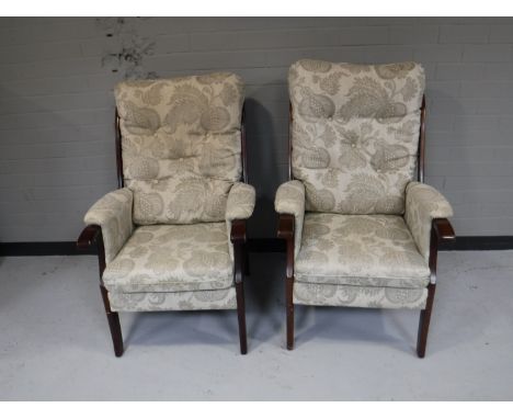 A pair of button back fire side chairs