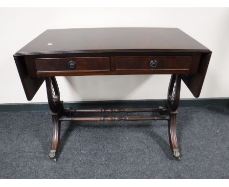 An inlaid mahogany sofa table fitted two drawers 